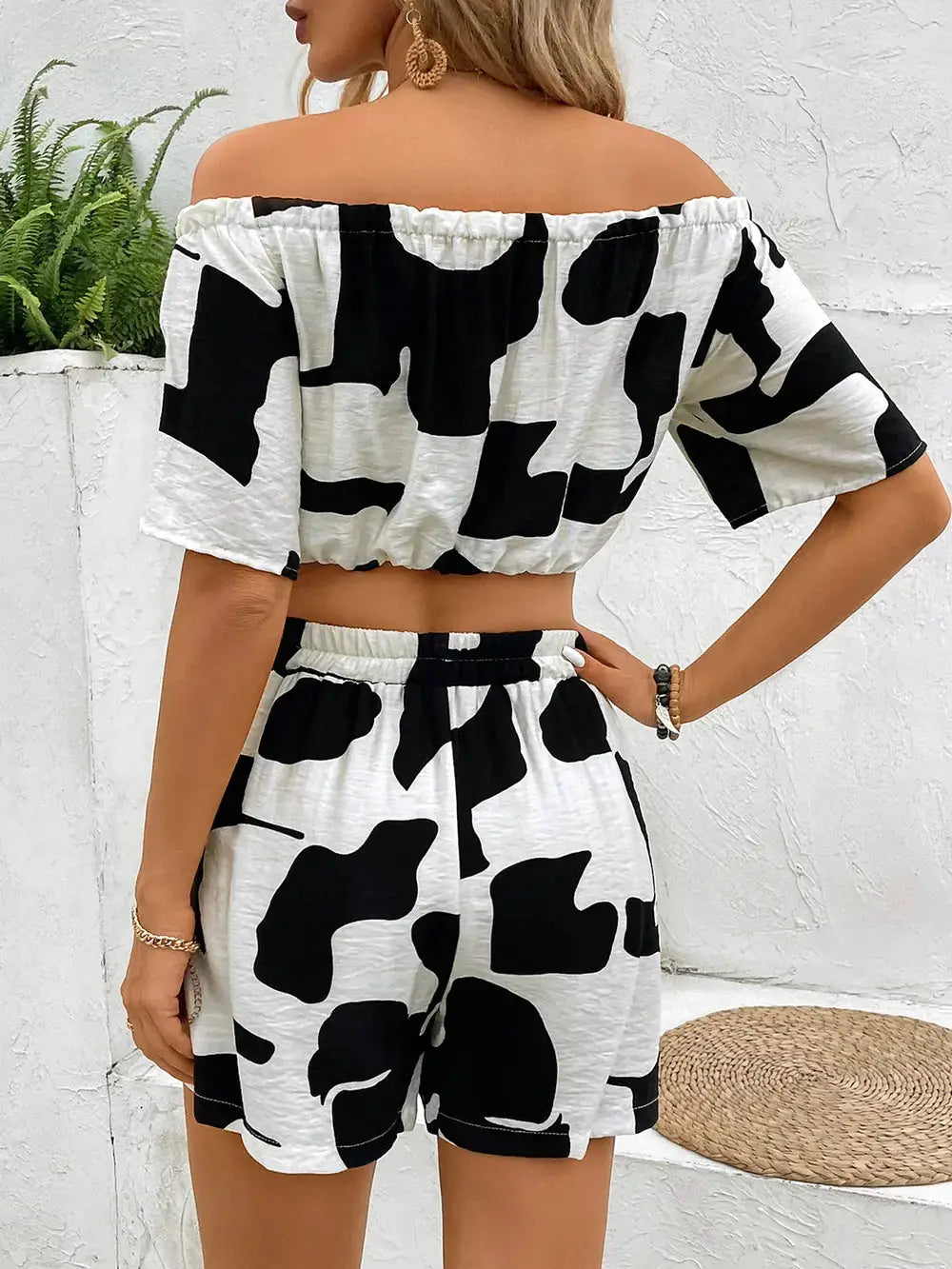 Back view of Perfee Drawstring Off-Shoulder Top and Shorts Set with bold black and white pattern and relaxed fit for summer wear.