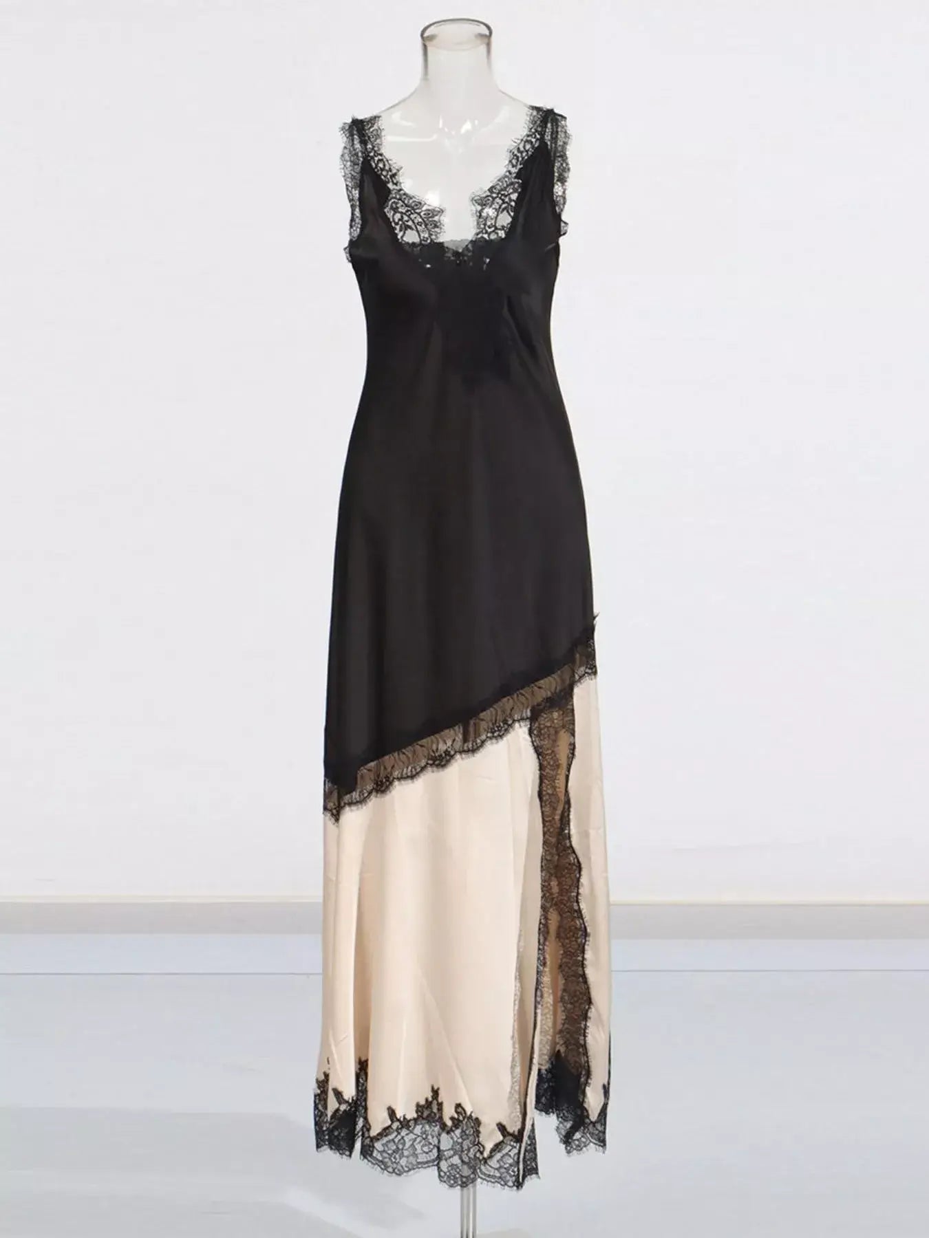 Black Cream Lace Trimmed Two-Tone Slip Dress on mannequin showcasing its elegant lace detailing.