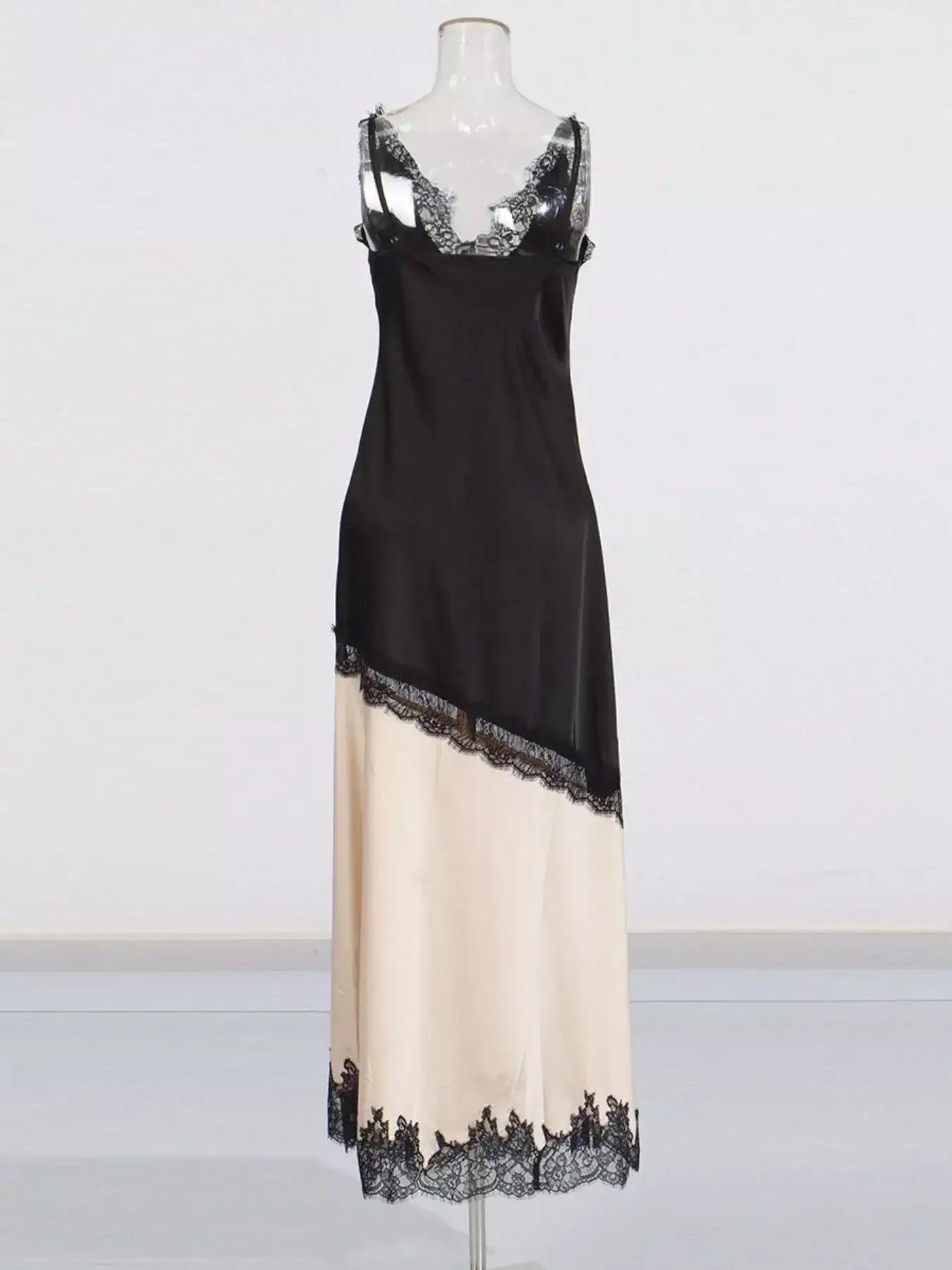 Black Cream Lace Trimmed Two-Tone Slip Dress displayed on a mannequin, featuring lace trim and a stylish split design.