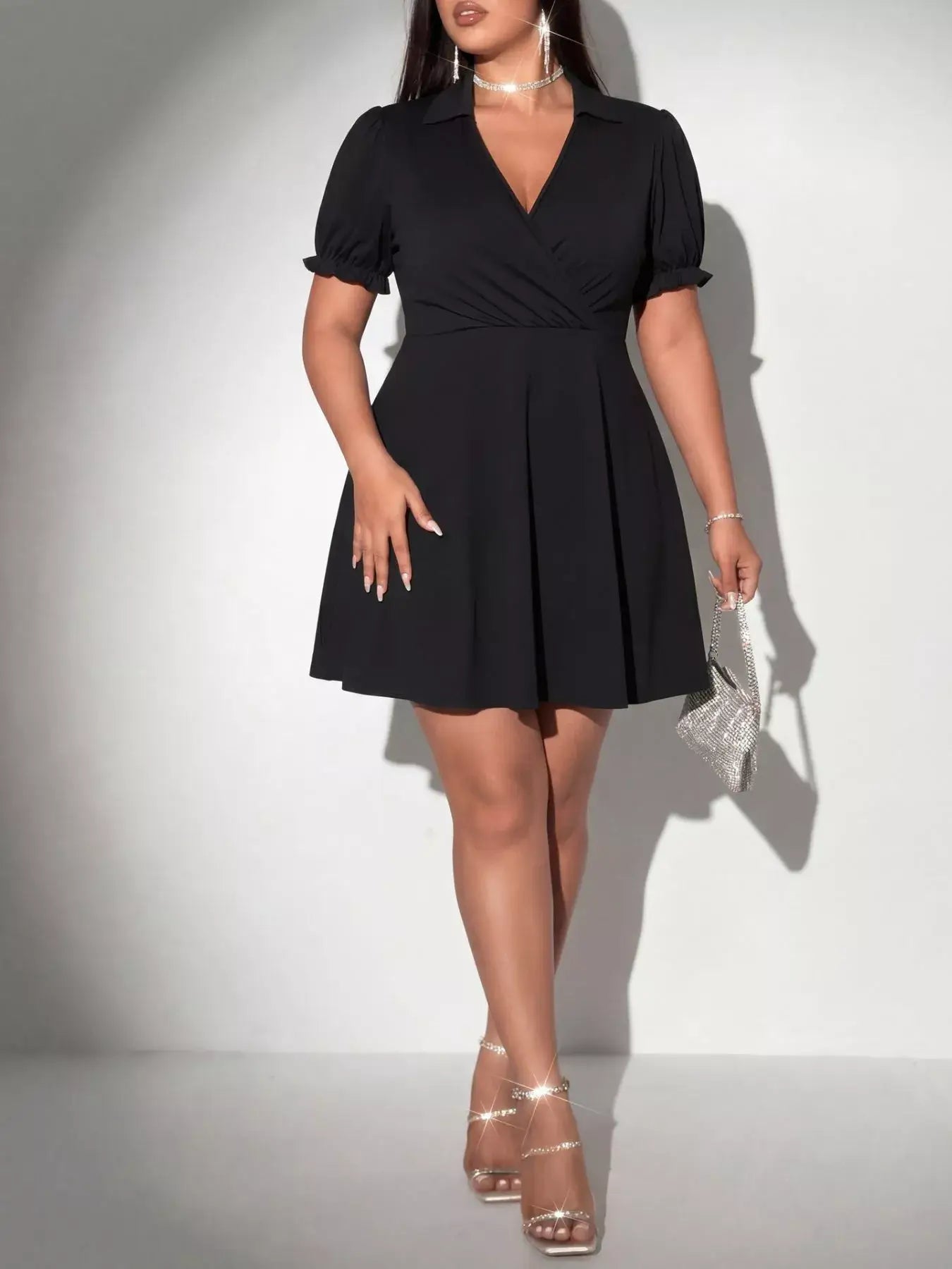 Black Plus Size Short Sleeve Mini Dress featuring a collared V-neckline and flared skirt, perfect for a night out.