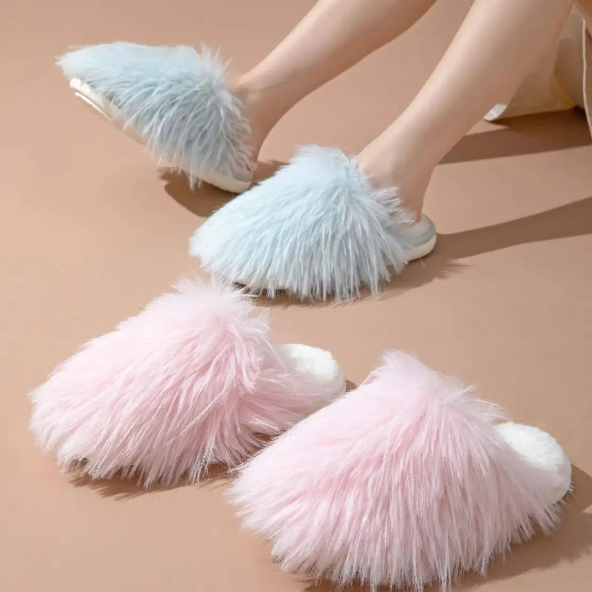 Assorted fluffy round toe flats slippers in pink and blue, showcasing comfy PVC design for fashionable indoor wear.