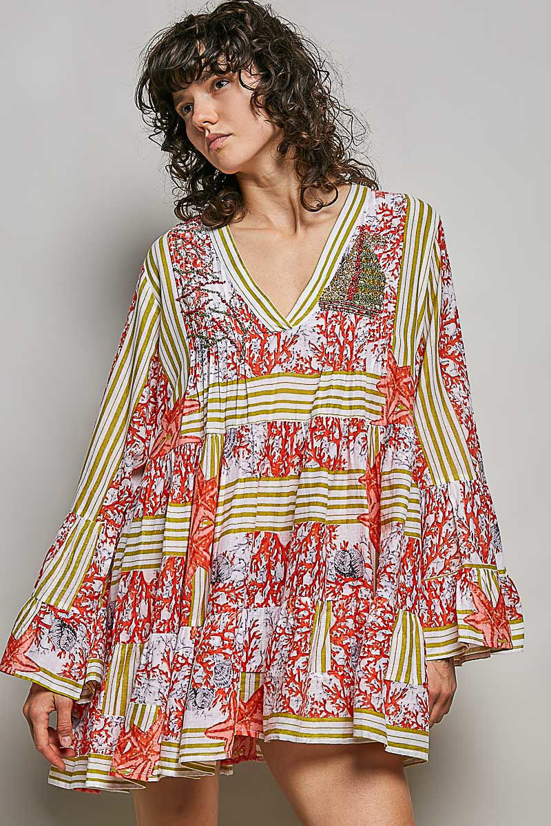 POL Striped Floral Long Sleeve Mini Dress with Pintuck Detail worn by a model featuring a V-neckline and ruffle cuffs.