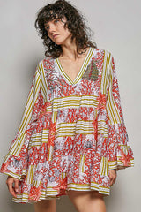 POL Striped Floral Long Sleeve Mini Dress with Pintuck Detail worn by a model featuring a V-neckline and ruffle cuffs.