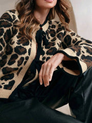 Leopard Print Bow-Tie Front Cropped Cardigan styled with black pants for a chic, modern look.