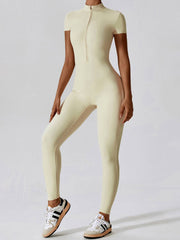 Sporty cream Basic Bae Half Zip Short Sleeve Active Jumpsuit with a high neckline and zip closure, perfect for activewear fashion.