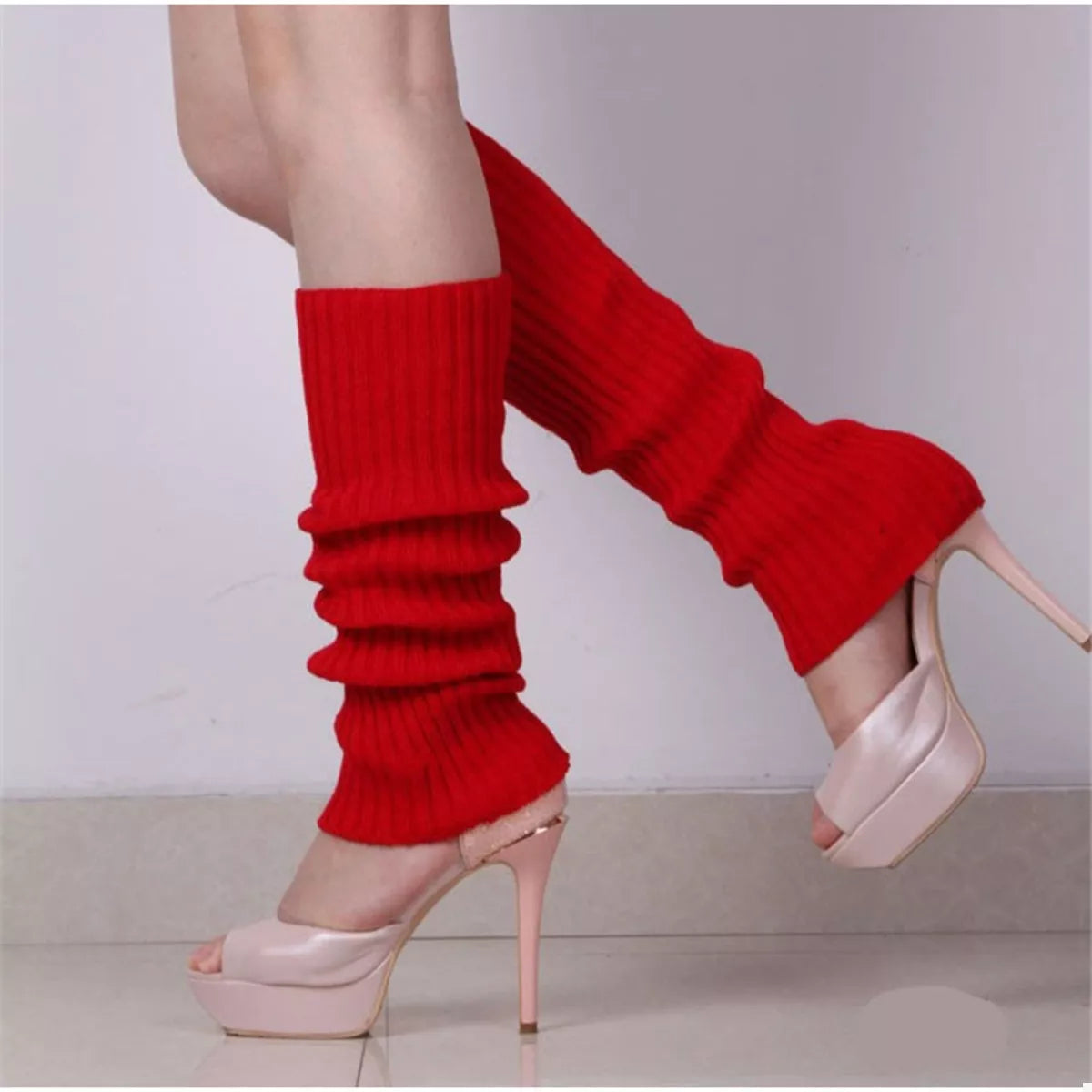 Ribbed Knit Leg Warmers in red paired with high heels, showcasing trendy winter fashion.