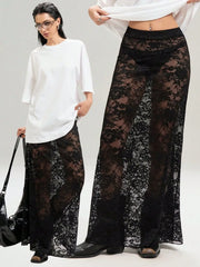 Women's chic lace maxi skirt in sheer black, paired with casual white top and black boots. Versatile for day or night styling.