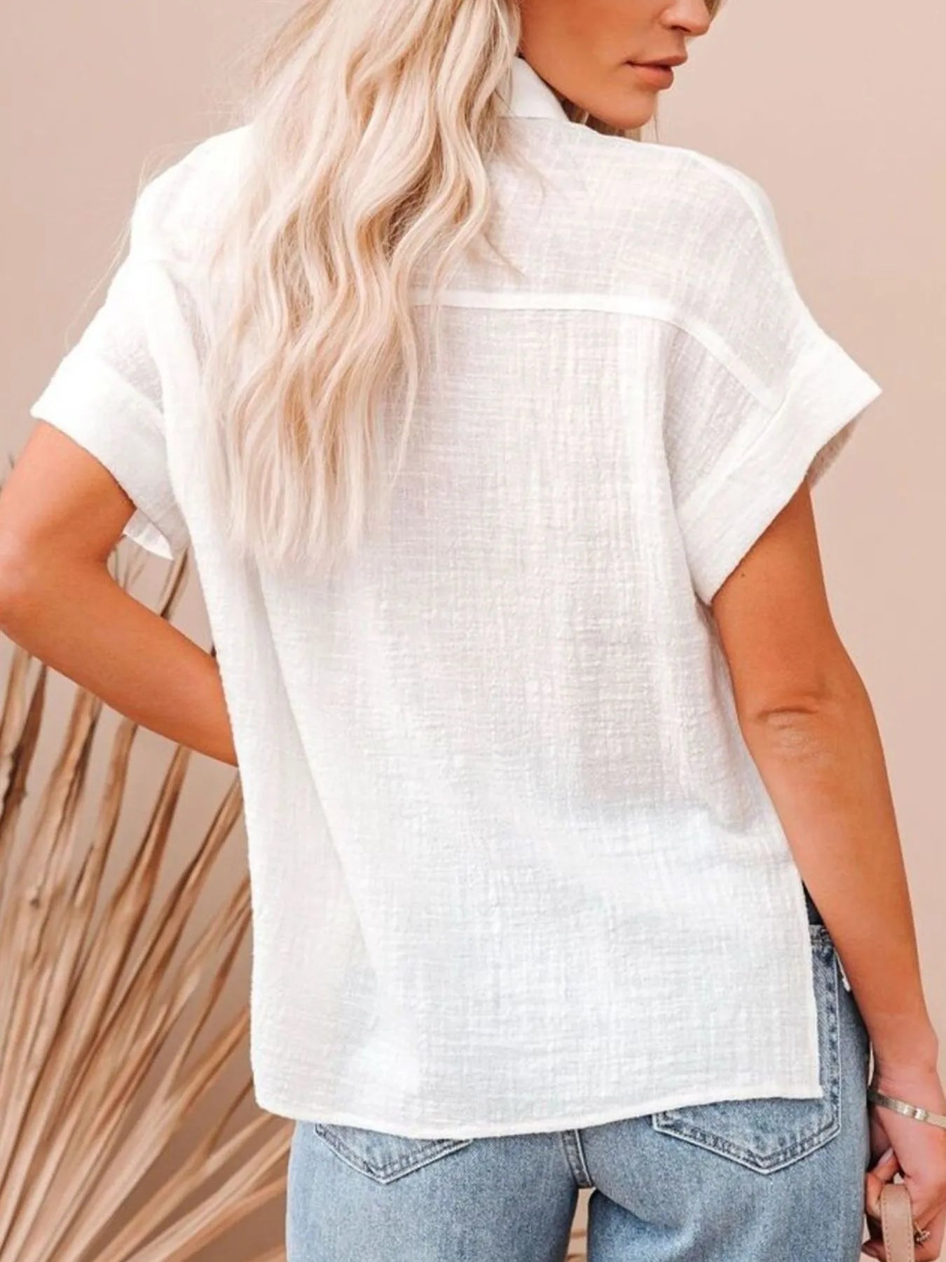 Back view of a woman wearing a Cotton Button Up Short Sleeve Shirt, showcasing the lightweight fabric and casual style.