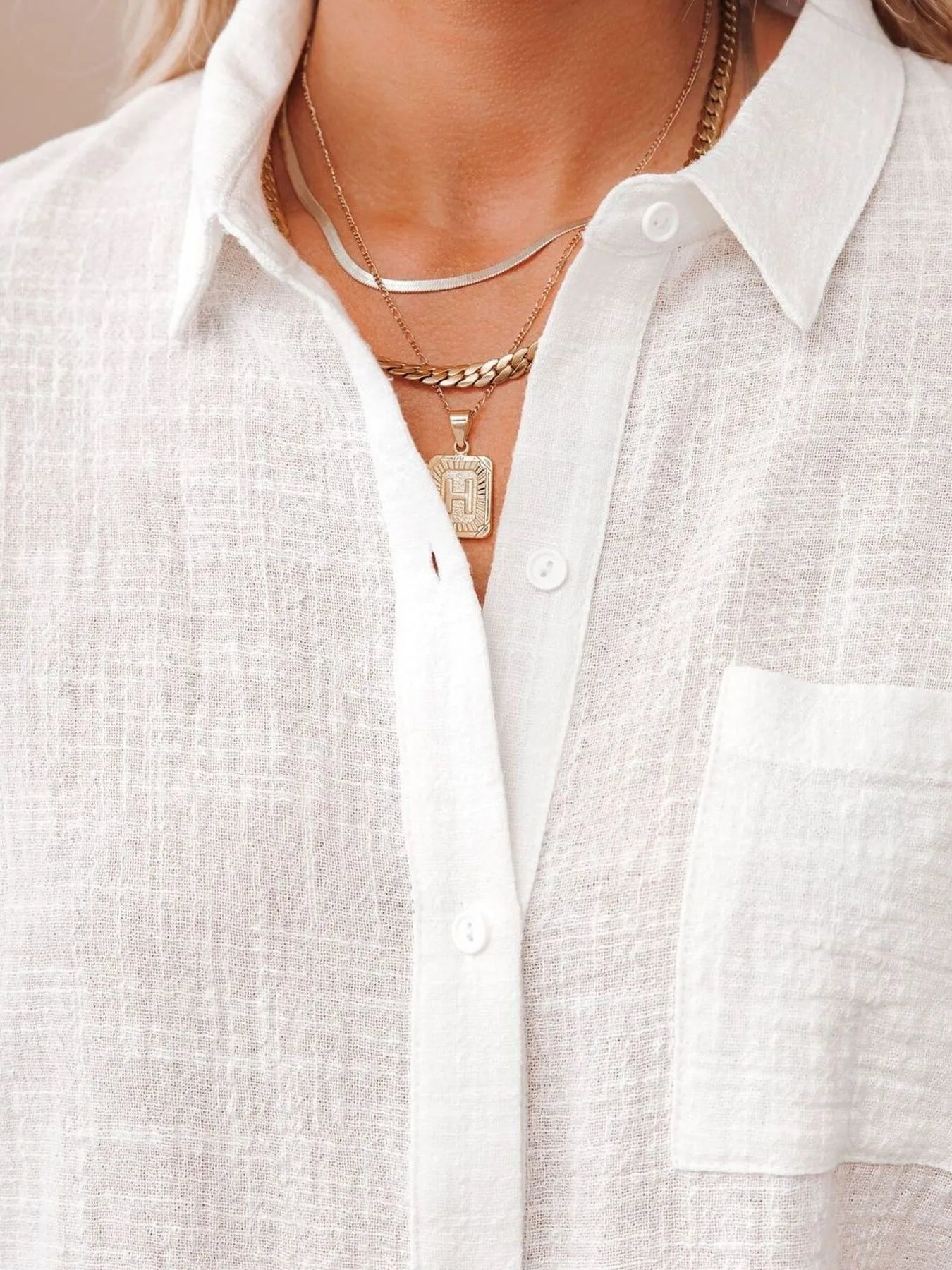 Close-up of a Cotton Button Up Short Sleeve Shirt featuring a buttoned collar and a chest pocket.