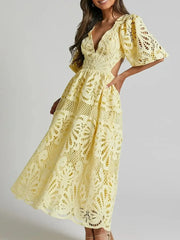 Elegant cutout back lace crochet V-neck dress in yellow with intricate patterns, perfect for evening or special occasions.