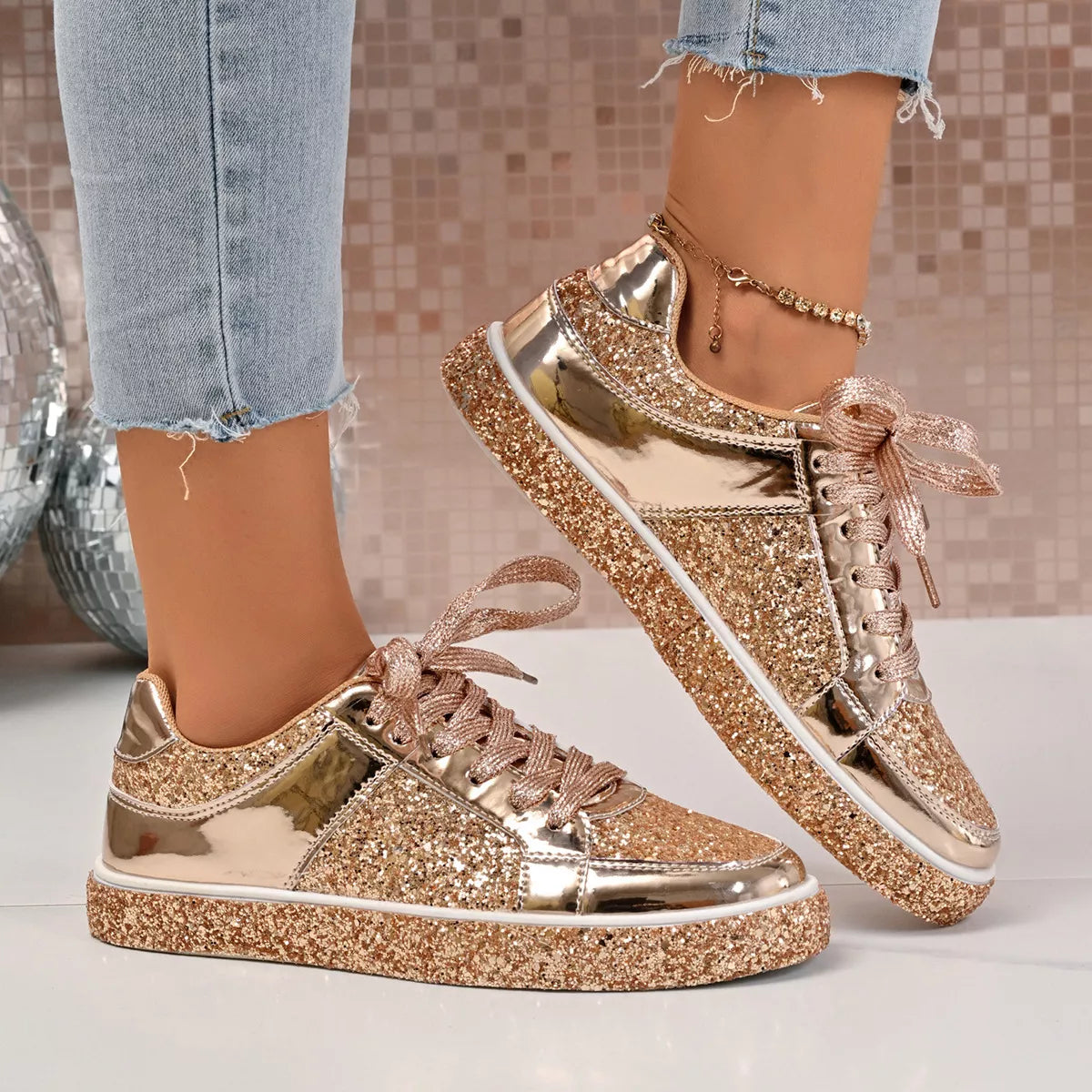 Shiny Sequin Lace Up Sneakers with gold glitter and metallic finish, worn with jeans, featuring PU leather and rubber material.