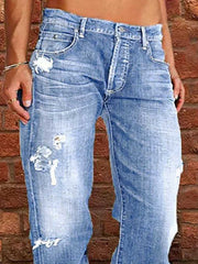 Person wearing Distressed Loose Fit Jeans with a vintage-inspired wash against brick wall.