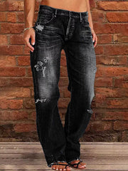 Person wearing Distressed Loose Fit Jeans with vintage-inspired wash against brick wall background.