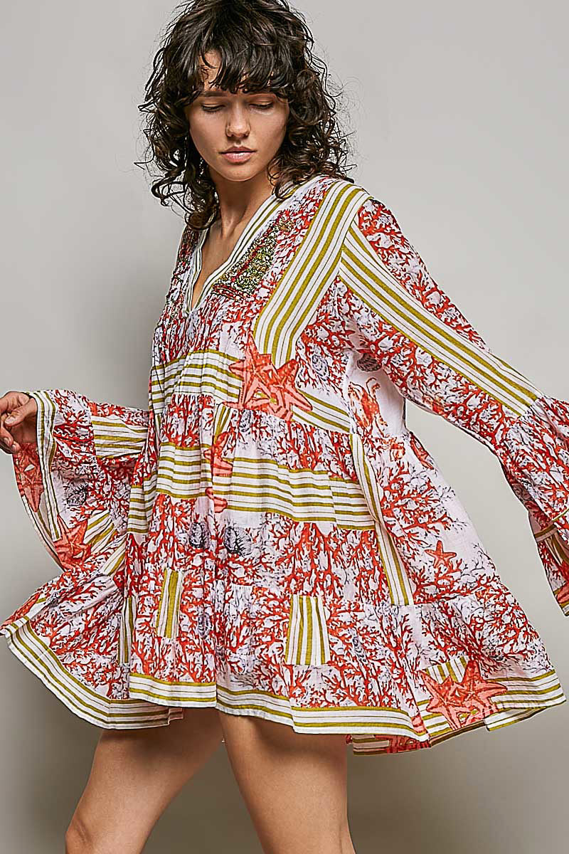 POL Striped Floral Long Sleeve Mini Dress with Pintuck Detail featuring a vibrant coral and starfish print.