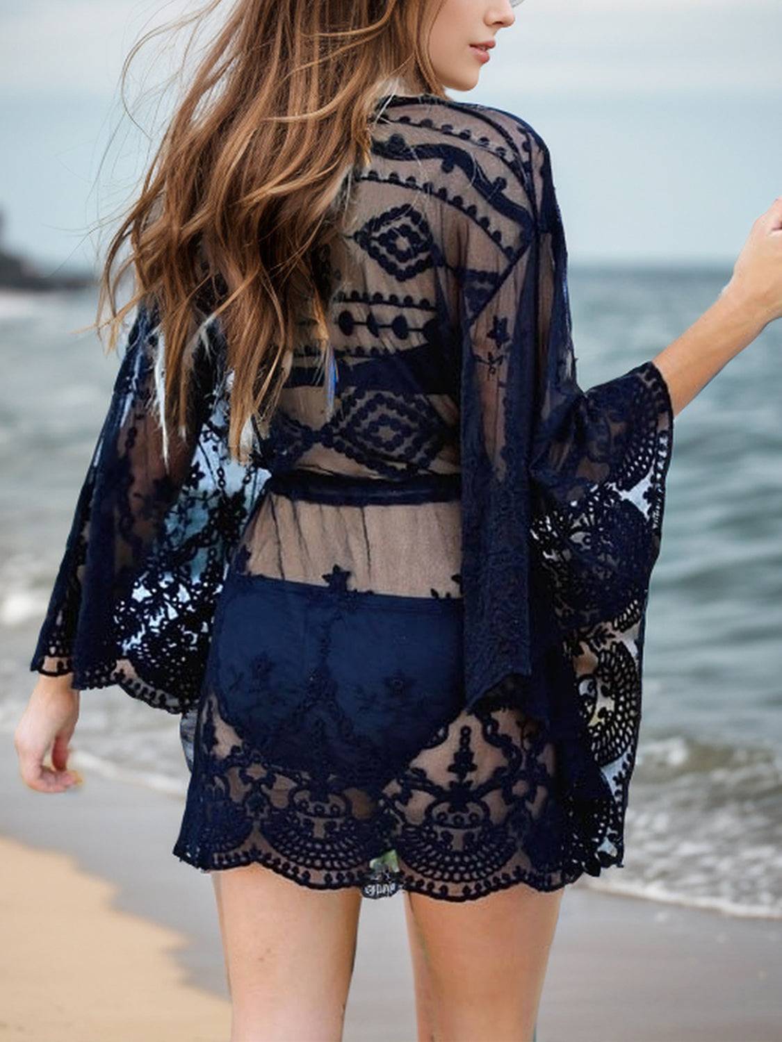 Back view of black Lace V-Neck Three-Quarter Sleeve Cover Up showing intricate lace patterns and scalloped hem, ideal for stylish beach outings.