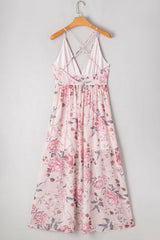 Back view of Floral Pleated Deep V Backless Maxi Dress on hanger, highlighting crisscross straps and flowing floral skirt.