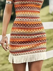 Close-up of Plus Size Full Fringe Grecian Neck Mini Dress showcasing detailed tribal print and white fringe trim for a chic bohemian look.