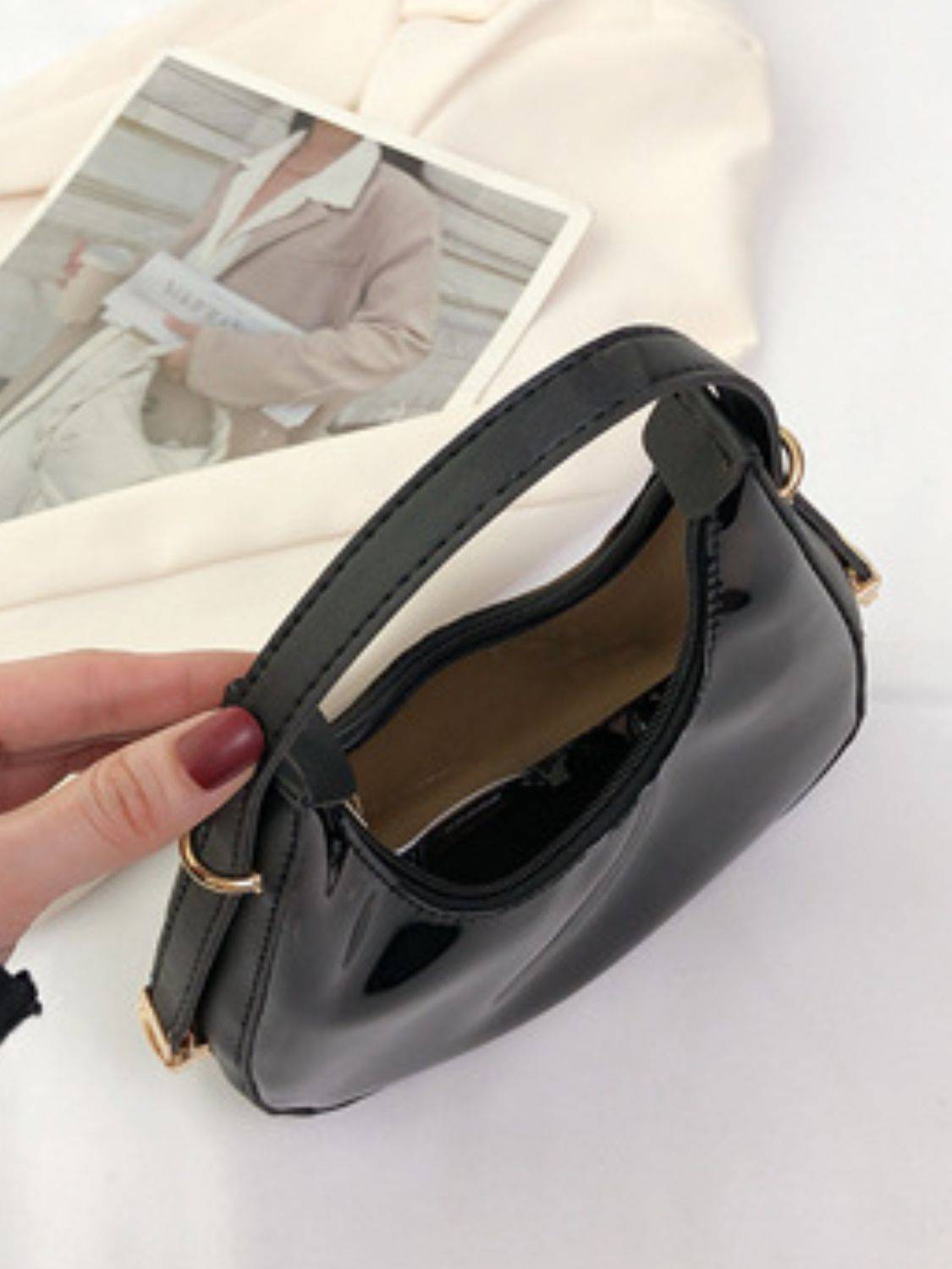 Top view of black PU Leather PVC Shoulder Bag showing spacious interior and sturdy handle for practical use.