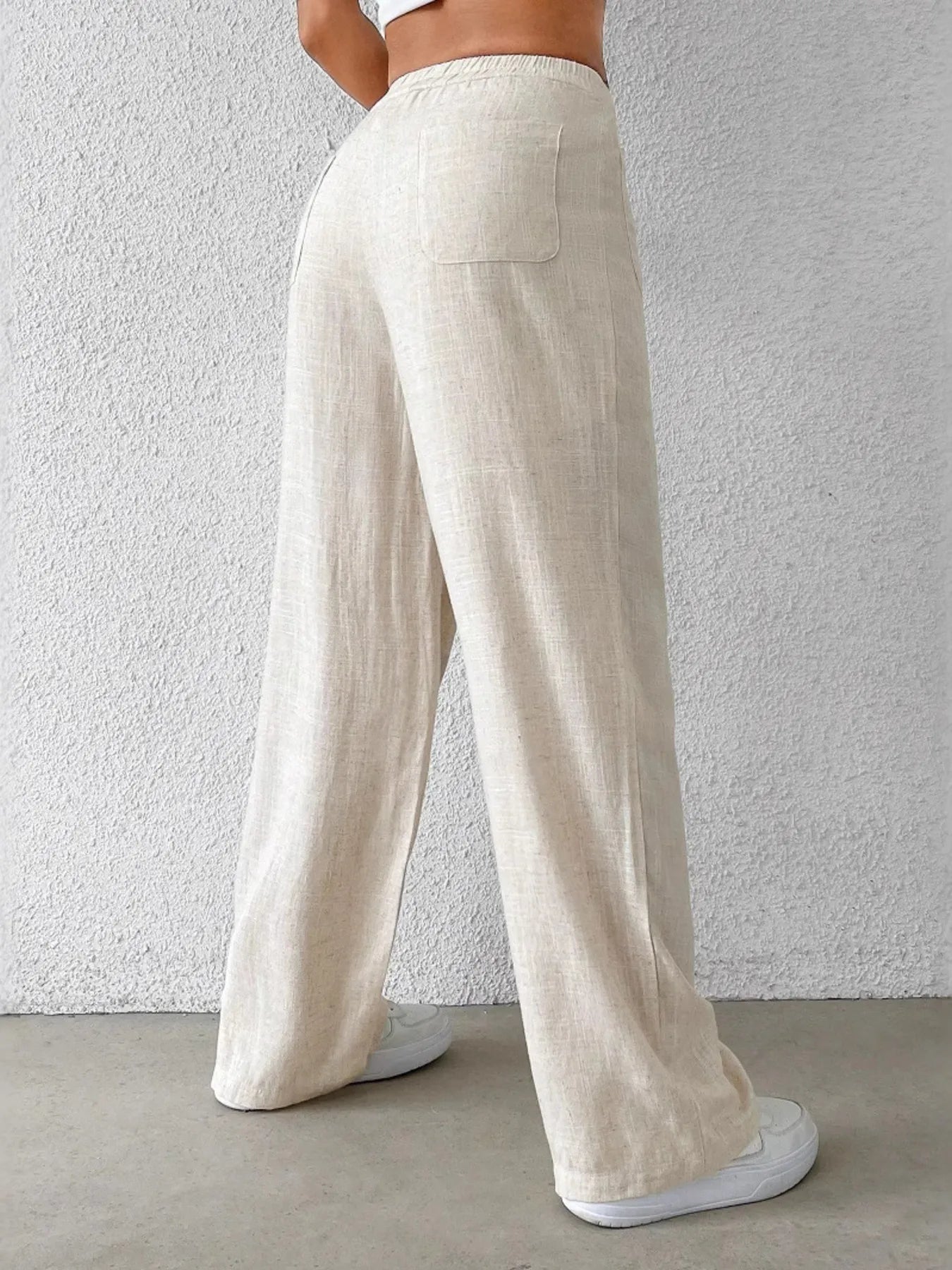 Fashionable Chic Wide-Leg Pants by GirlSavvi showing the back view with pockets and a relaxed fit.