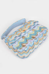 Faux Straw Flap Top Handle Bag featuring a stylish zigzag pattern with a top handle and gold accents.