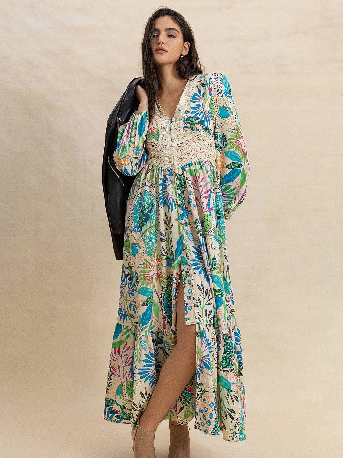 Effortlessly Chic Slit Printed V-Neck Long Sleeve Midi Dress paired with a black jacket, highlighting its boho floral design and slit detail.