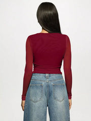 Back view of woman wearing Rhinestone Embellished Long Sleeve T-Shirt with jeans, showcasing the fitted silhouette and casual style.