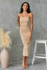 Model wearing tan strapless washed denim dress with a fitted silhouette, ideal for rooftop weekends or date nights.