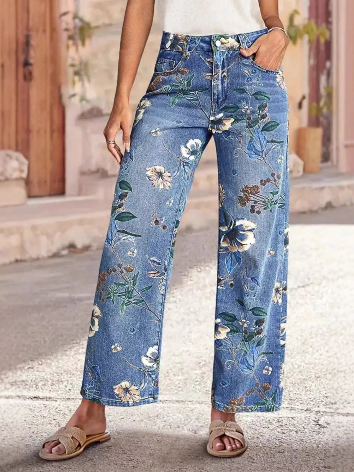 Floral Print Wide Leg Jeans displayed on a model, featuring a vibrant floral pattern and a pocketed design.