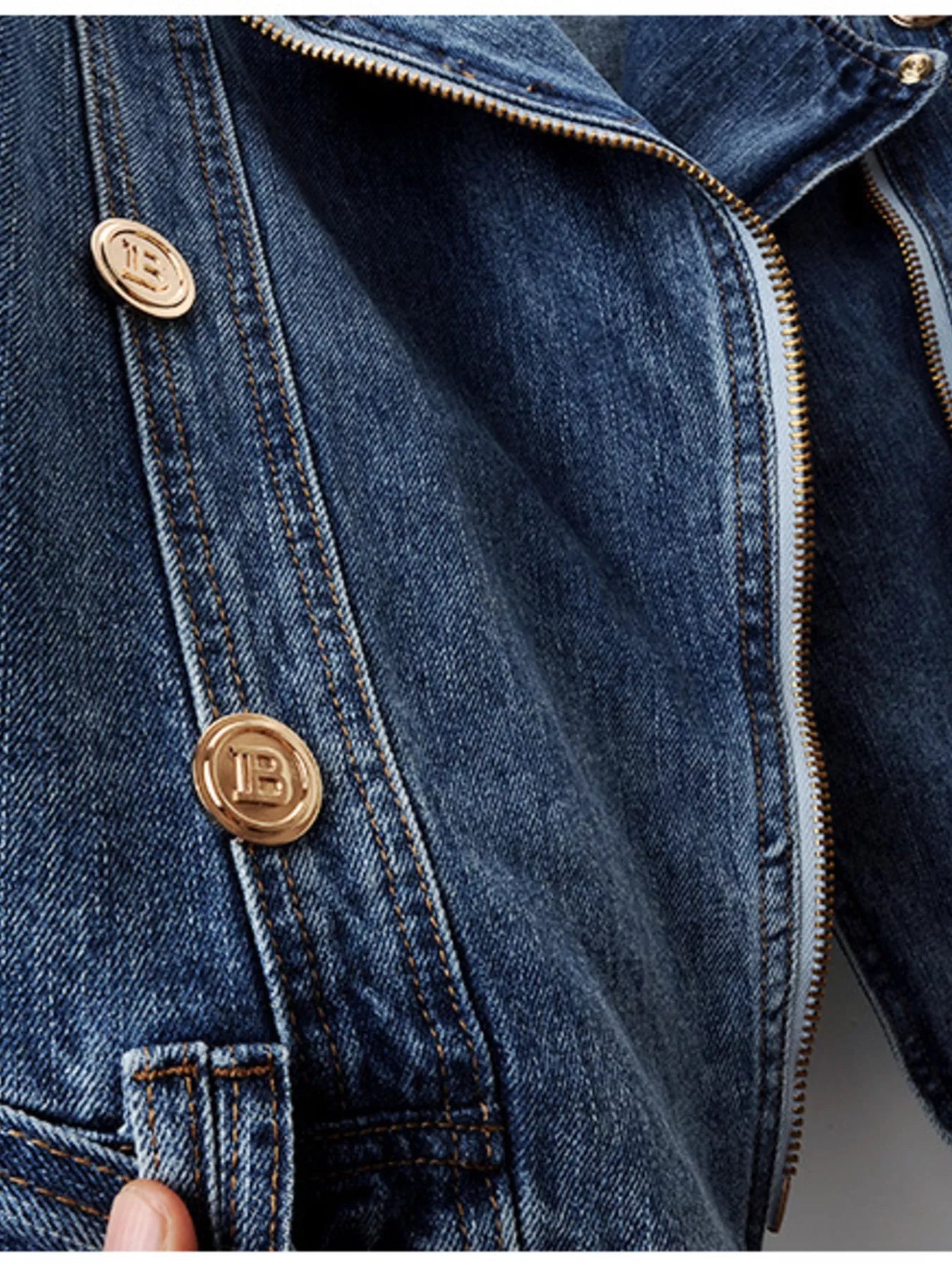 Close-up of the GirlSavvi Zip Denim Jacket featuring gold button details and zipper.