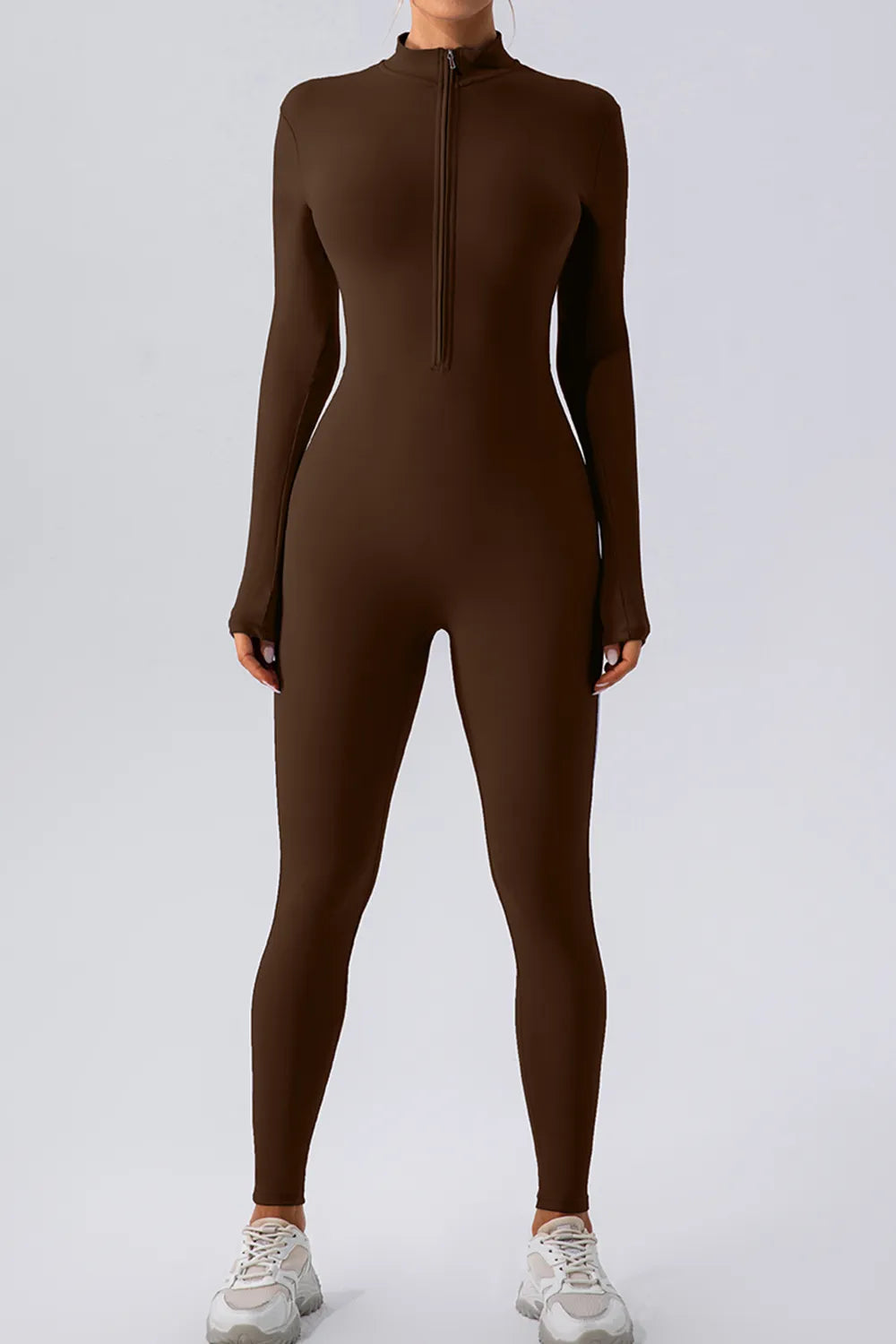 Half Zip Mock Neck Active Jumpsuit in brown, featuring a front half-zip closure and long sleeves for a sleek activewear look.