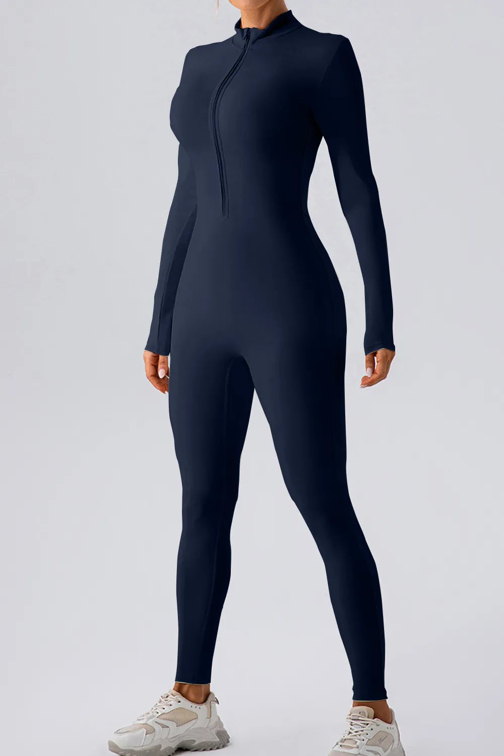 Half Zip Mock Neck Active Jumpsuit in navy color, showcasing sleek design and front half-zip closure for active wear.