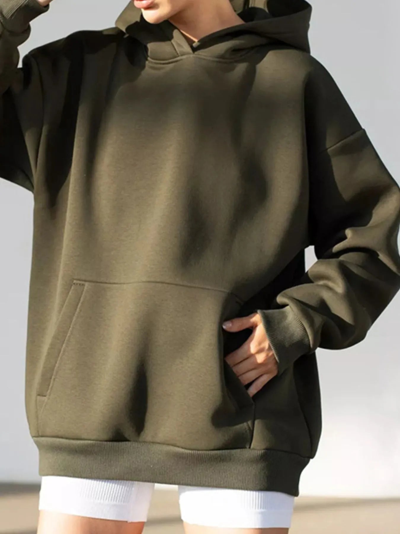 Kangaroo Pocket Long Sleeve Hoodie in olive, featuring cozy spandex blend and practical front pocket design for stylish everyday wear.