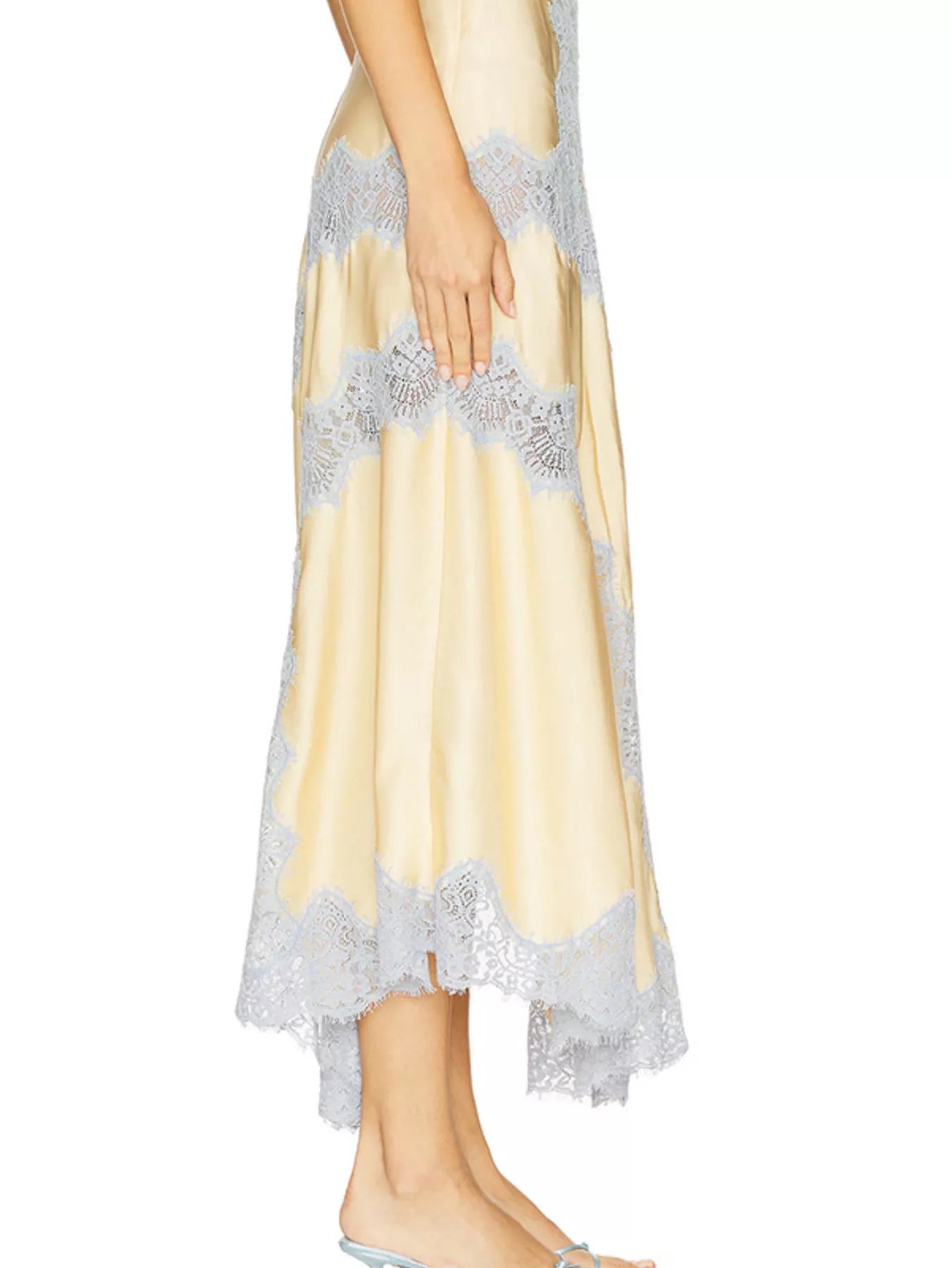 Lace Detail Cami and Skirt Set showcasing a side view of a sheer yellow skirt with lace trim details.