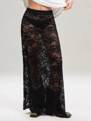 Chic and stylish lace maxi skirt in sheer black lace, perfect for layering over swimwear and shorts for a bold fashion statement.
