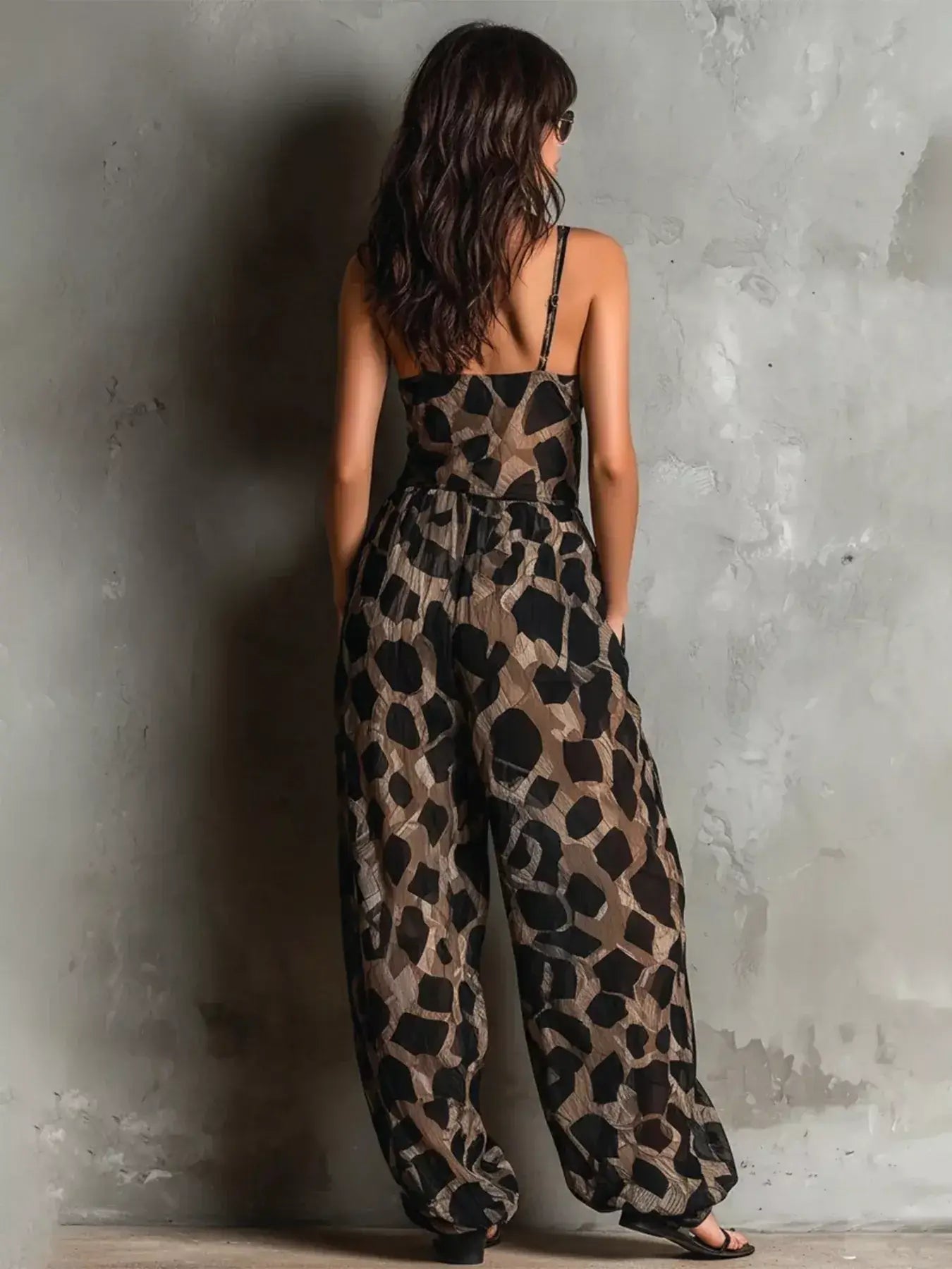 Back view of Leopard Front Tie Detail Wide-Leg Jumpsuit featuring a tied design and leopard print pattern.