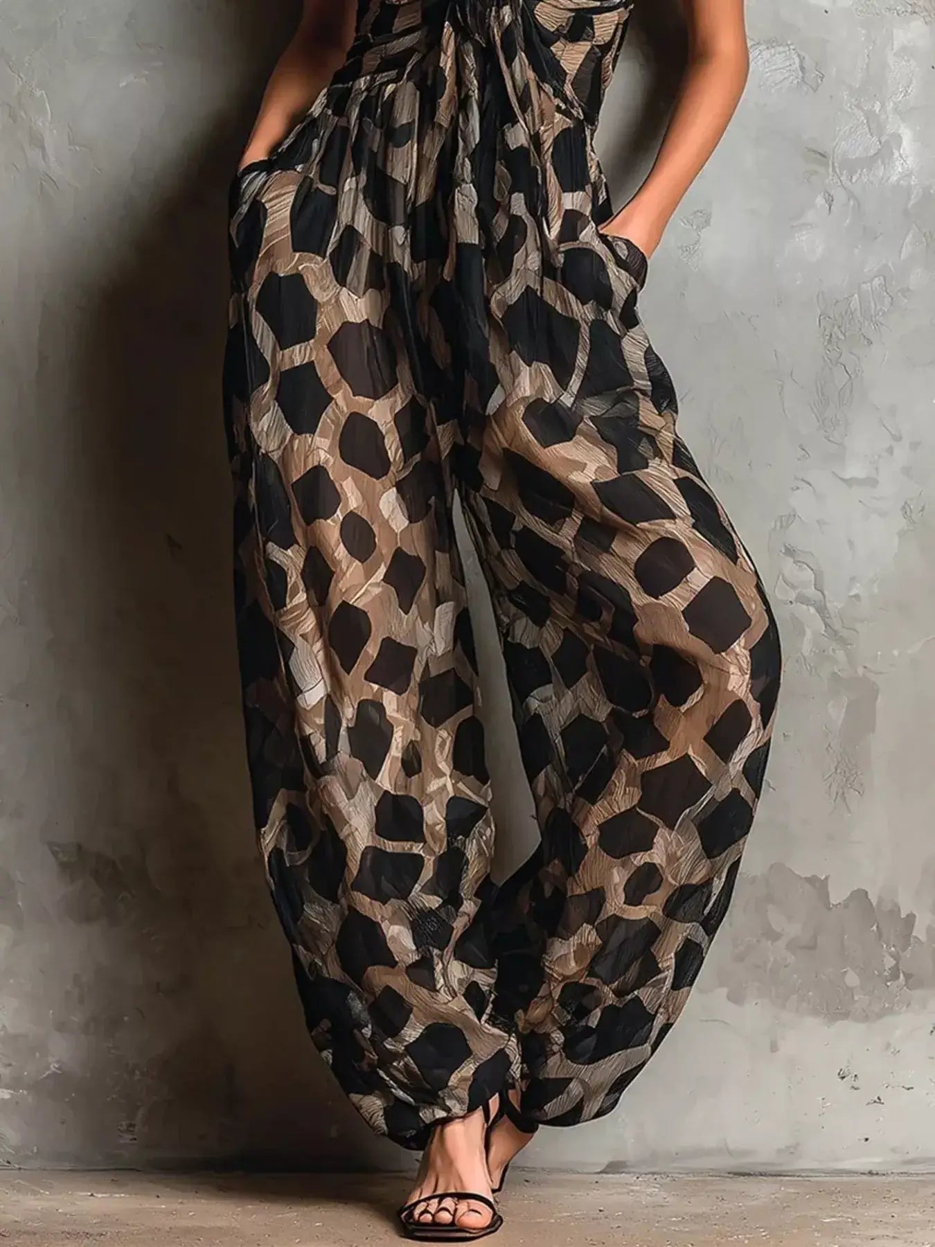 Leopard Front Tie Detail Wide-Leg Jumpsuit featuring a stylish design with pockets and a lightweight look.