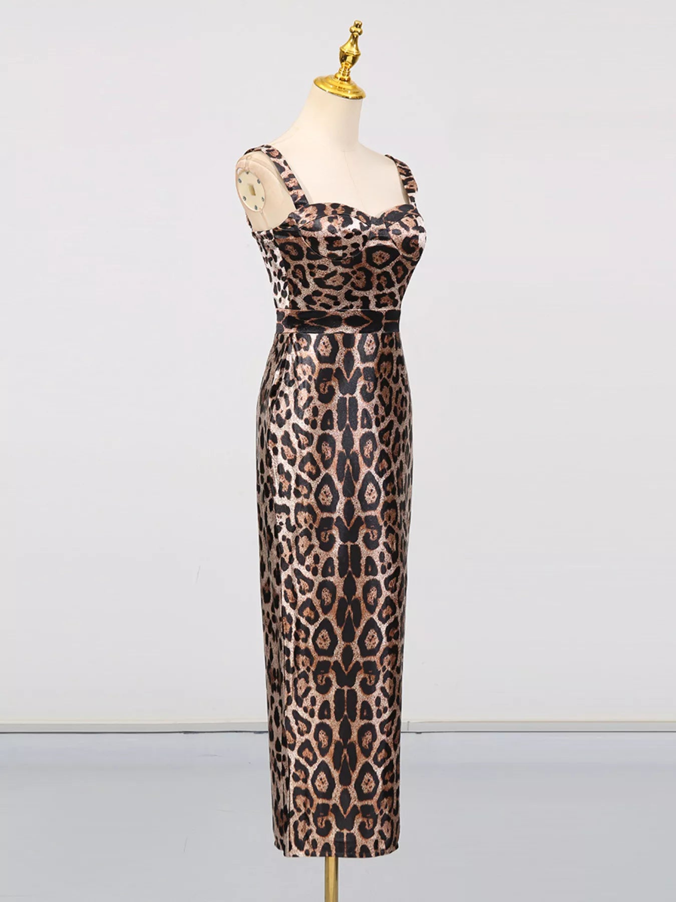 Leopard Print Bodycon Back Slit Midi Dress displayed on a mannequin showcasing its leopard print and back slit design.