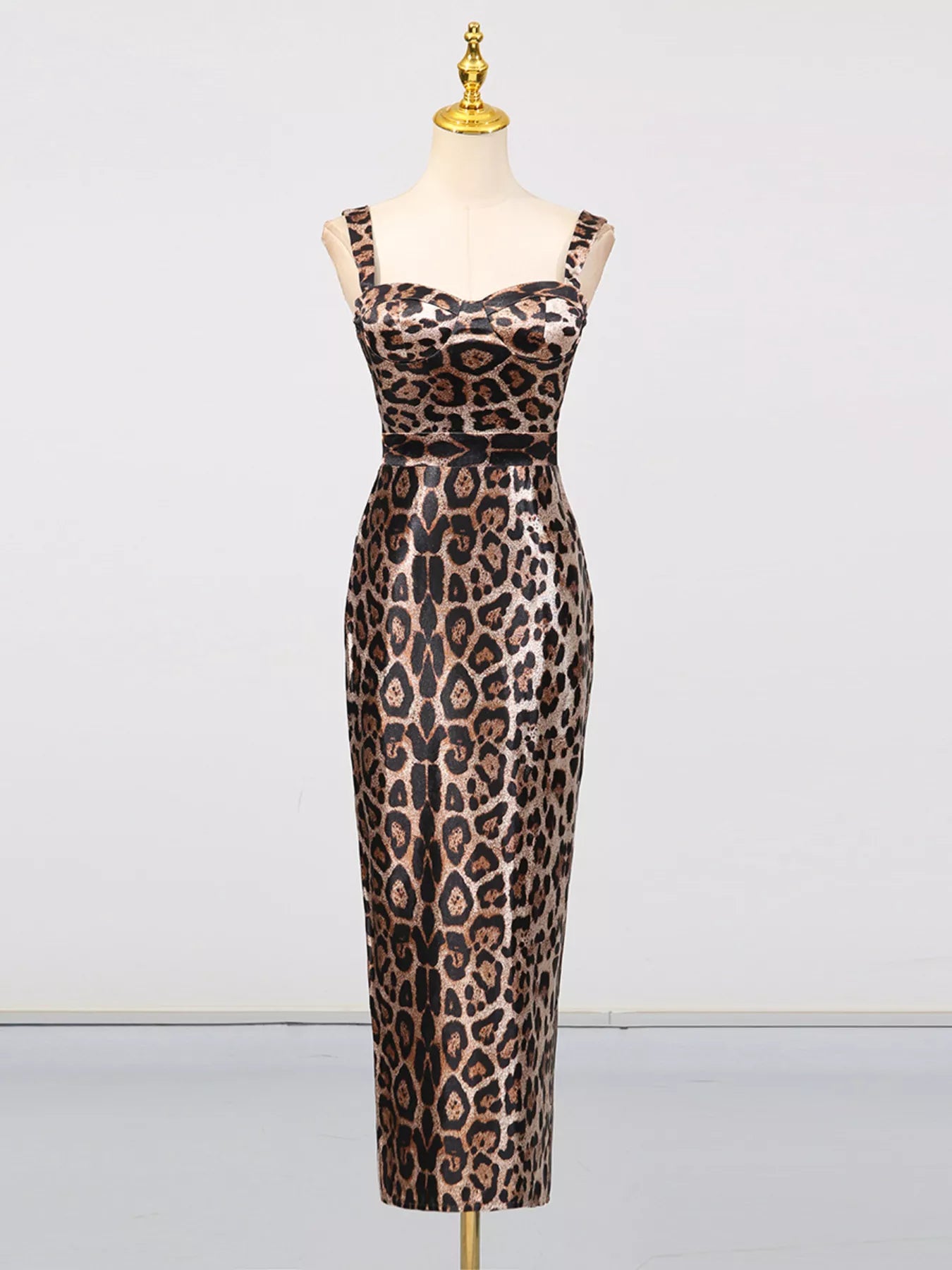 Leopard Print Bodycon Back Slit Midi Dress on mannequin showcasing its sleek design and animal print pattern.