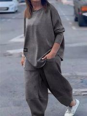 Casual Loose Fit Top and Pants Two-Piece Set worn by a model outdoors, combining comfort and style.