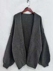 Oversized open front dropped shoulder cardigan with textured soft-touch polyester and voluminous sleeves on hanger.