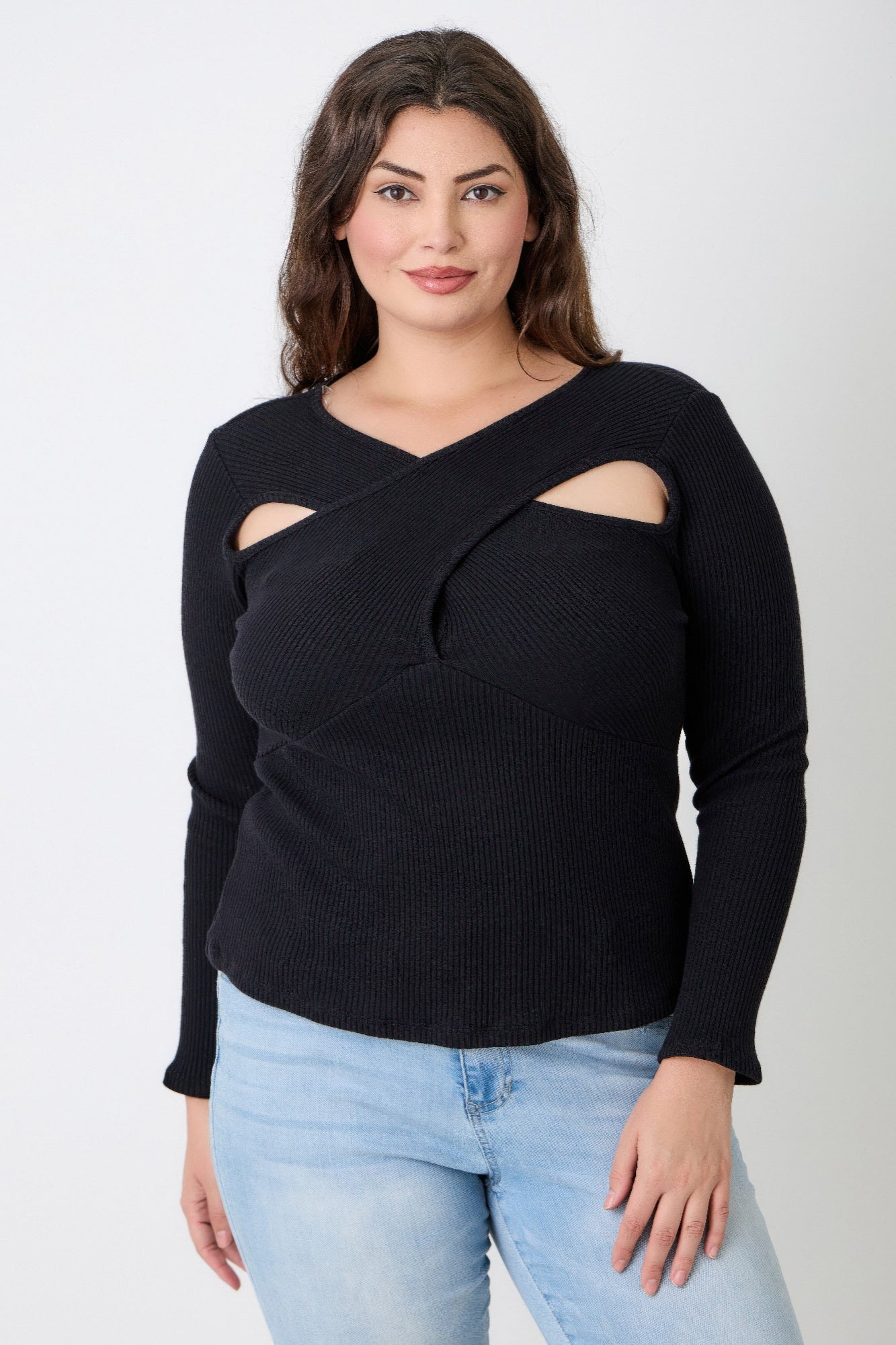 Plus Size Black Ribbed Cutout Long Sleeve Top worn by a model with stylish crossover cutout detail.