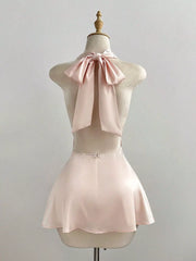 Satin Backless Halter Neck Dress showcasing a tied halter neck and ruched detailing in soft pink.