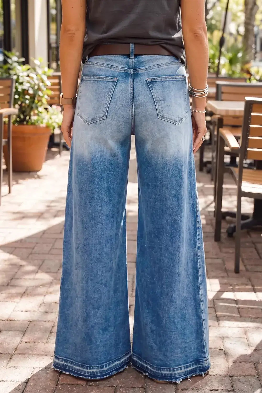 Back view of Side Seam Gathering Flare Leg Jeans featuring a two-tone washed finish and exaggerated flare silhouette.