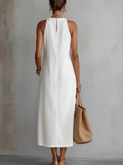 Back view of the Side Slit Sleeveless Hollow-Out Trimmed Midi Dress in white, showcasing a sleek design and casual style.