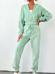 Sky blue zip up long sleeve top and pants set with drawstring waist and pockets, perfect for casual outings or travel.